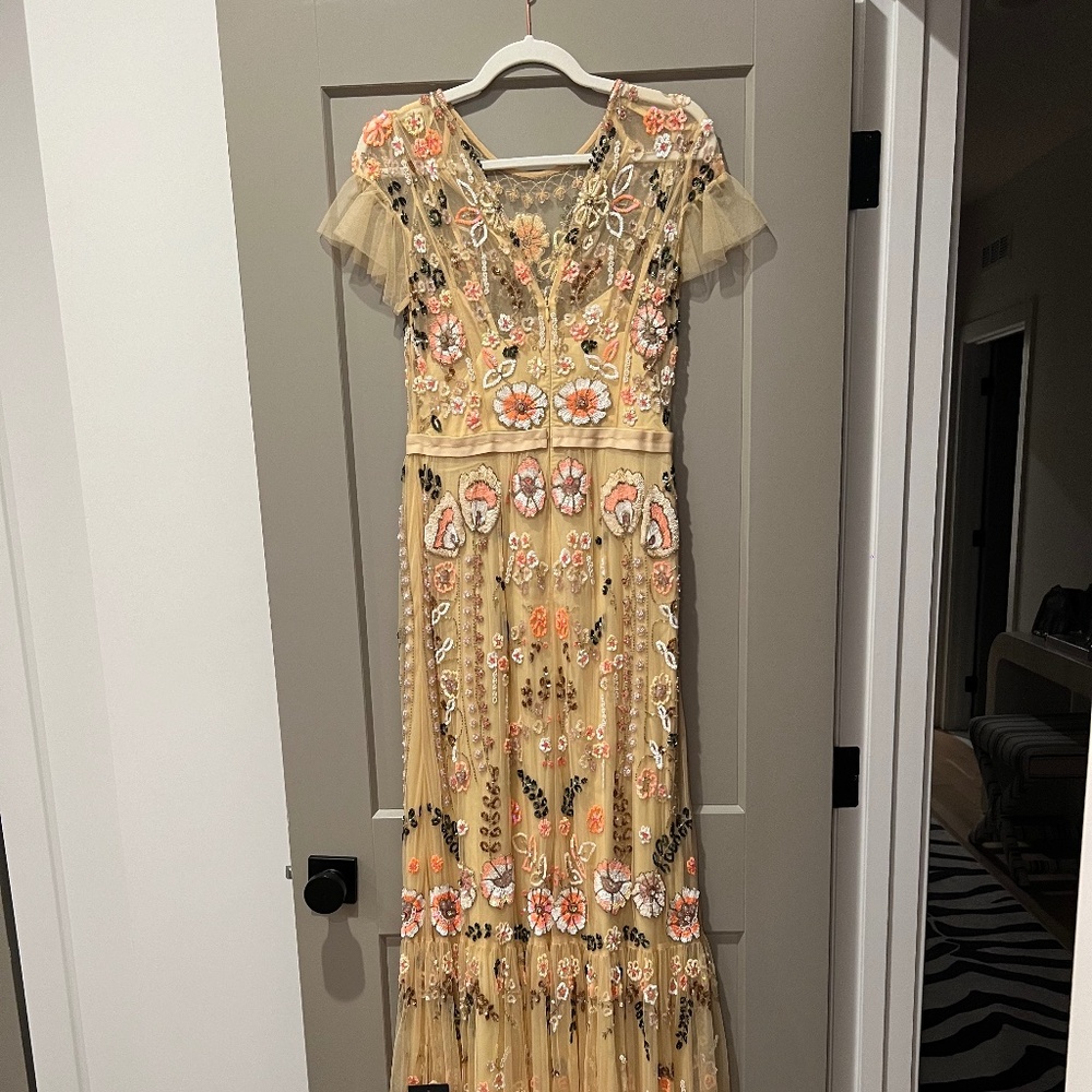 Needle and thread embroidered and beaded gown
